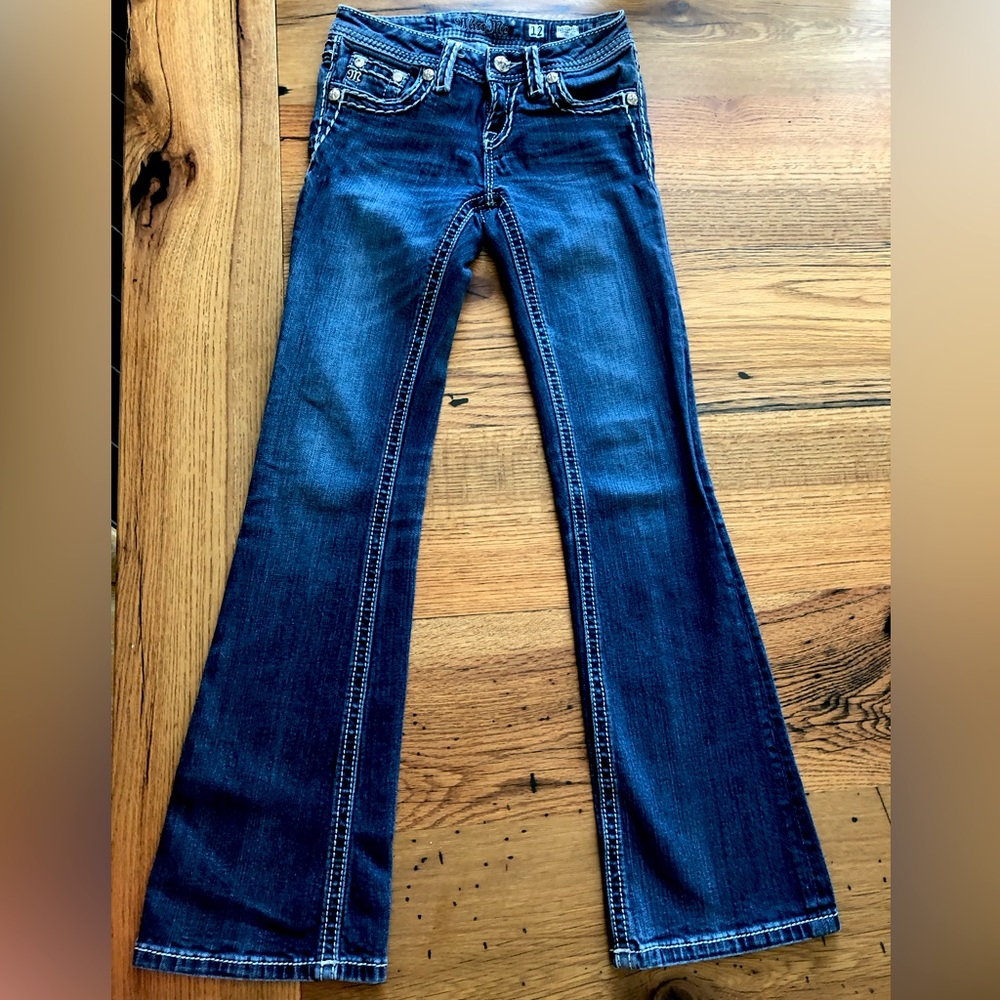 I’m selling Miss Me jeans, color is a darkish blue, size 12.